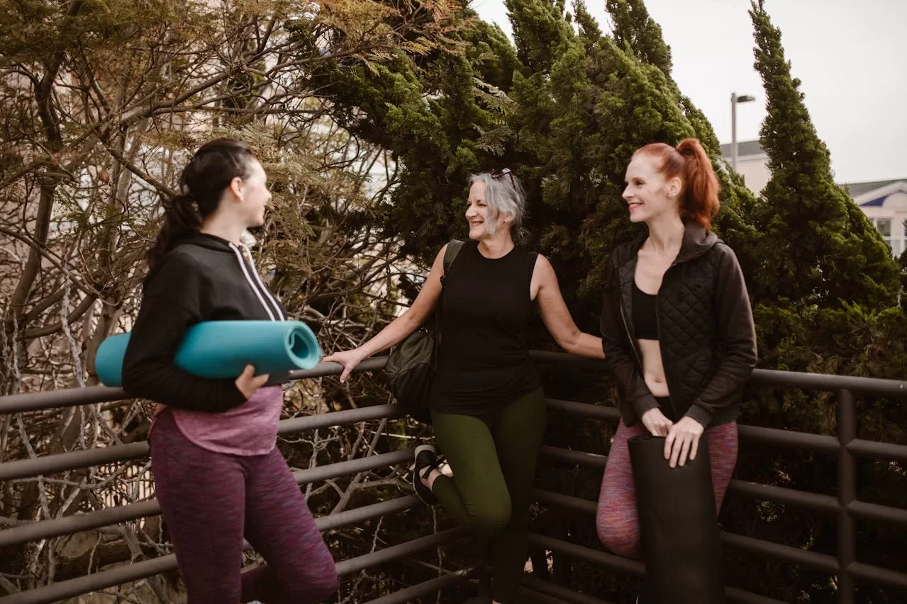 An image featuring three women representing different stages of life: a young adult, a middle-aged woman, and an older woman. They symbolize the various phases women go through in life, highlighting the importance of understanding hormonal health across different ages.